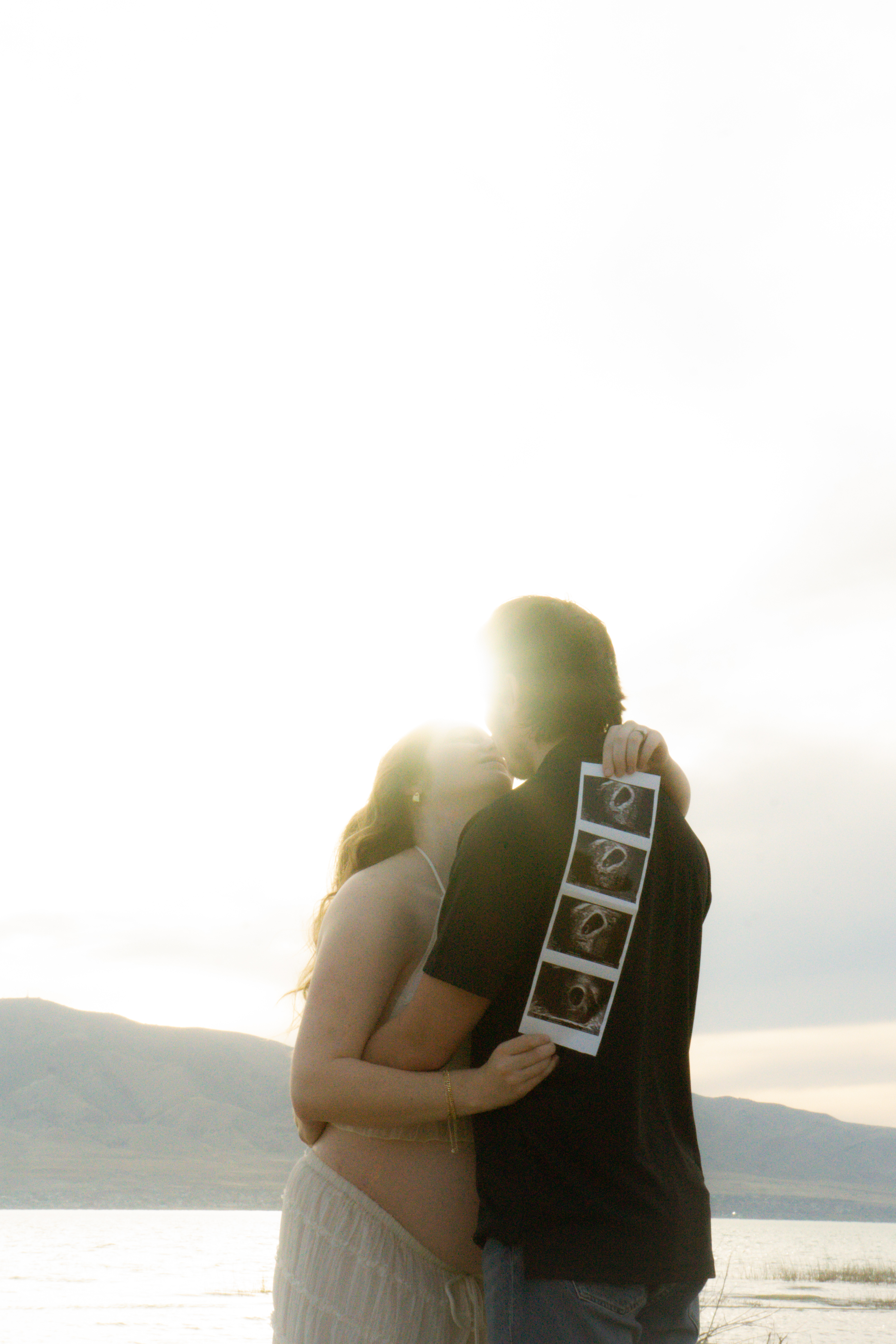 Couples — Sharing a tender moment with their sonogram