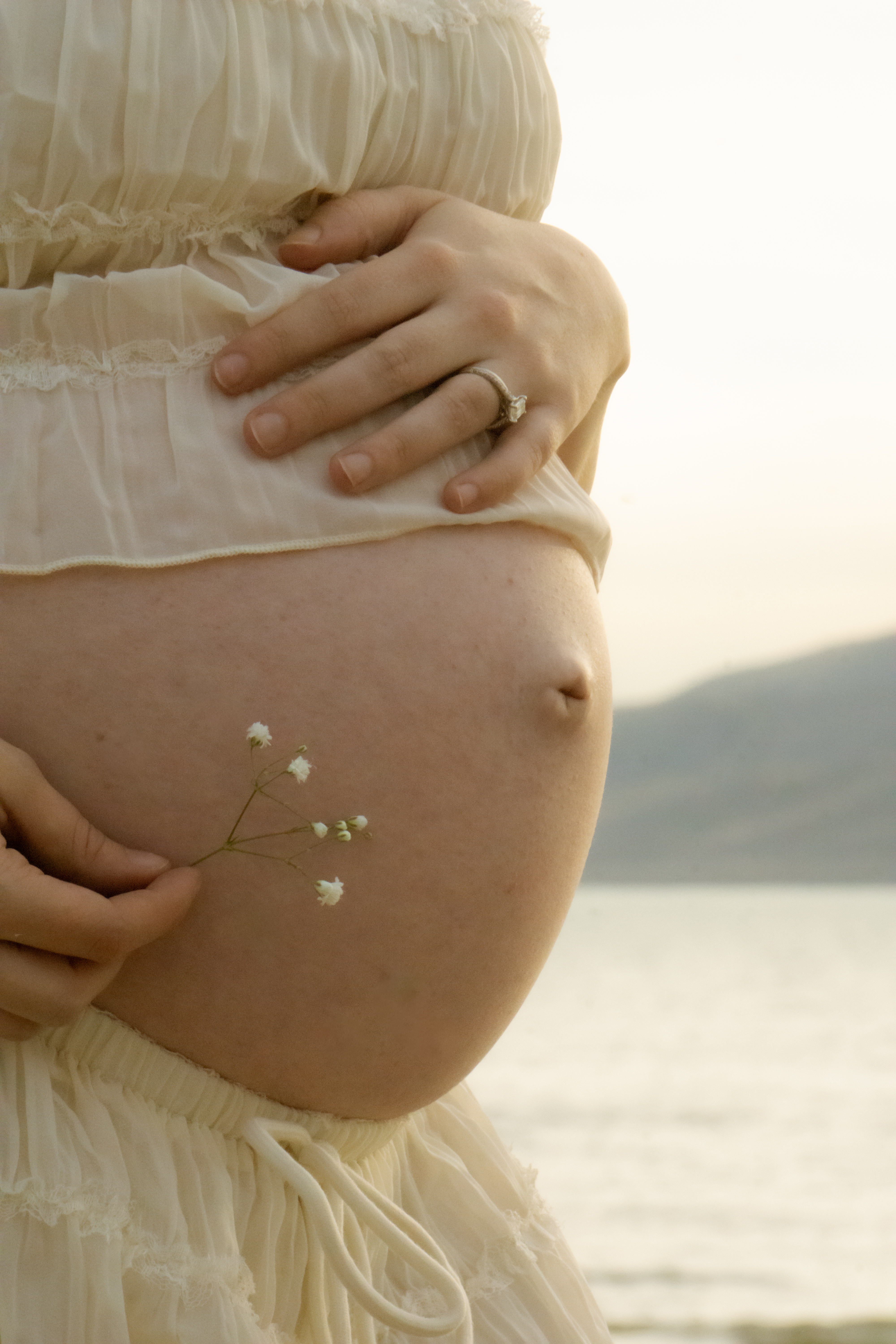 Family — Maternity close-up with a wildflower