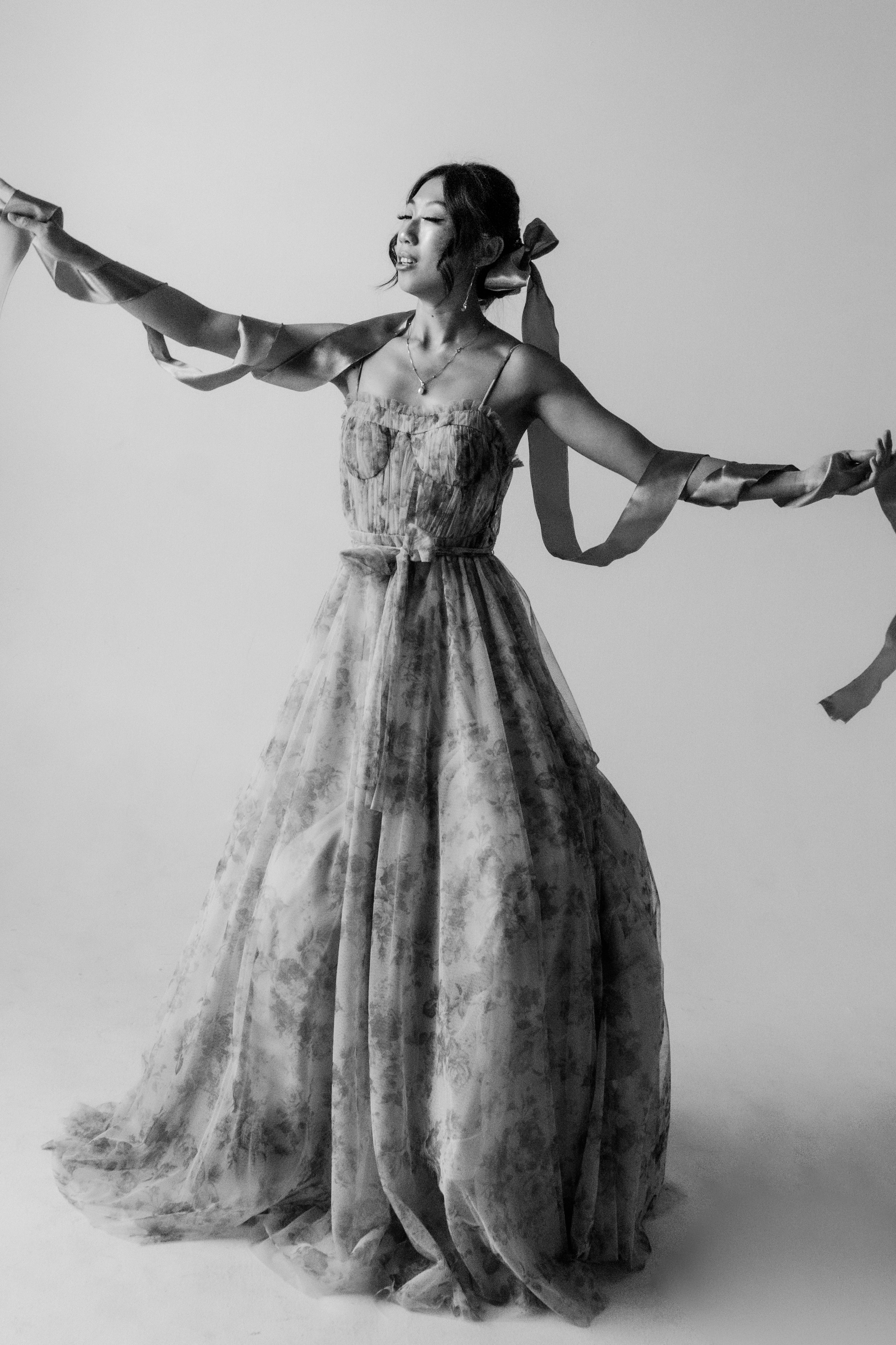 Fashion — Ballerina dancing with ribbons in black and white