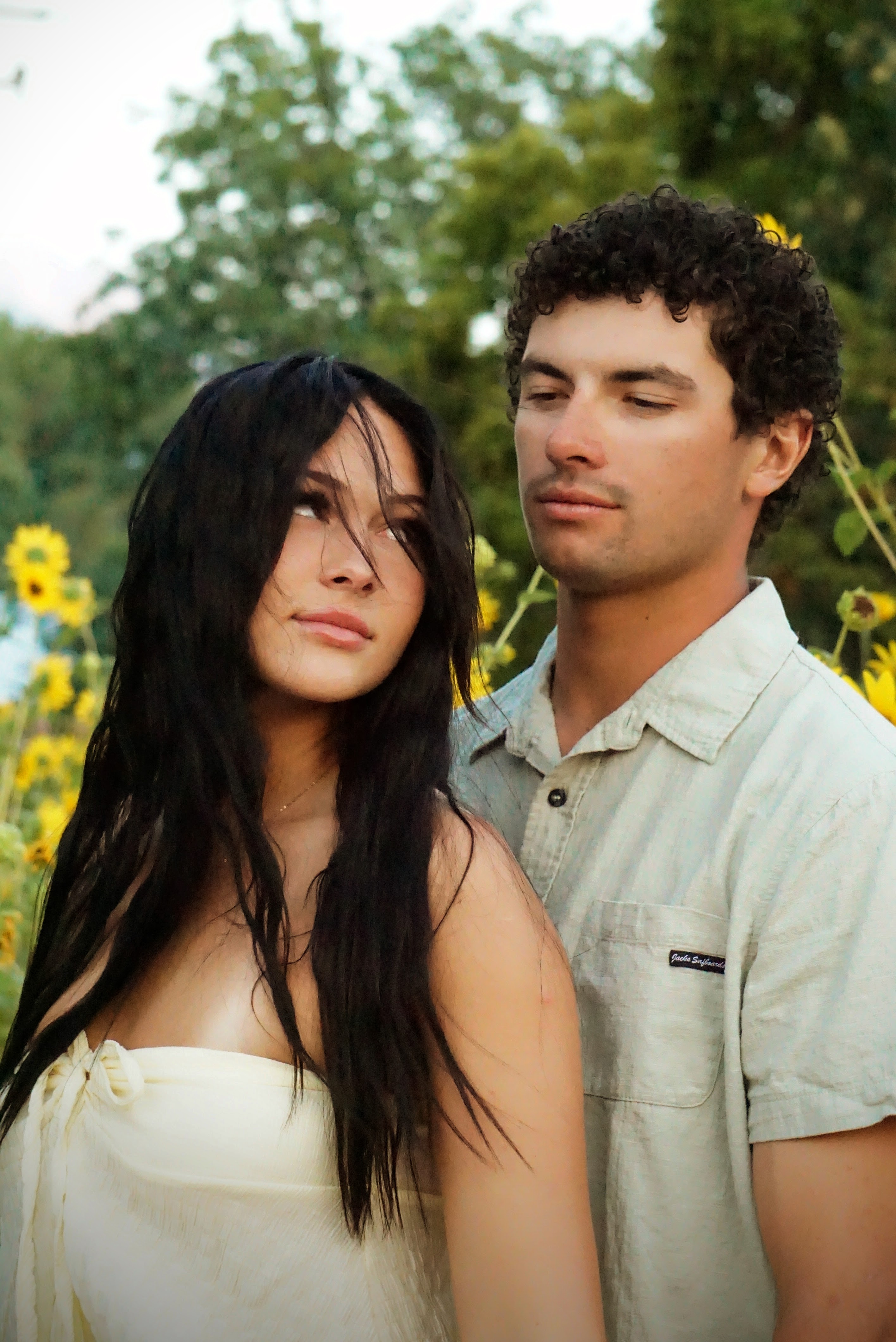 Couples — Two people together in a field of sunflowers