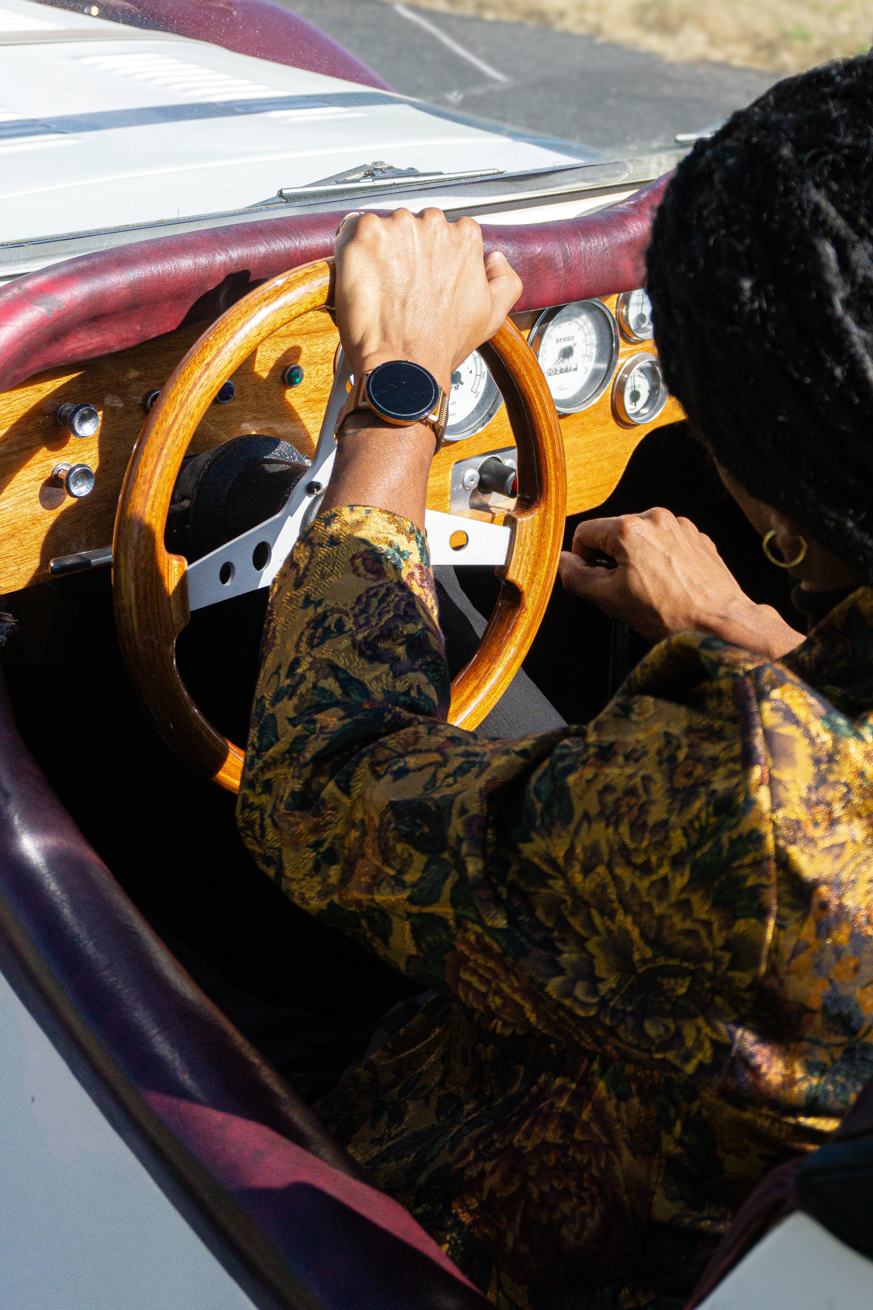 Lifestyle — Hands on a classic wooden steering wheel