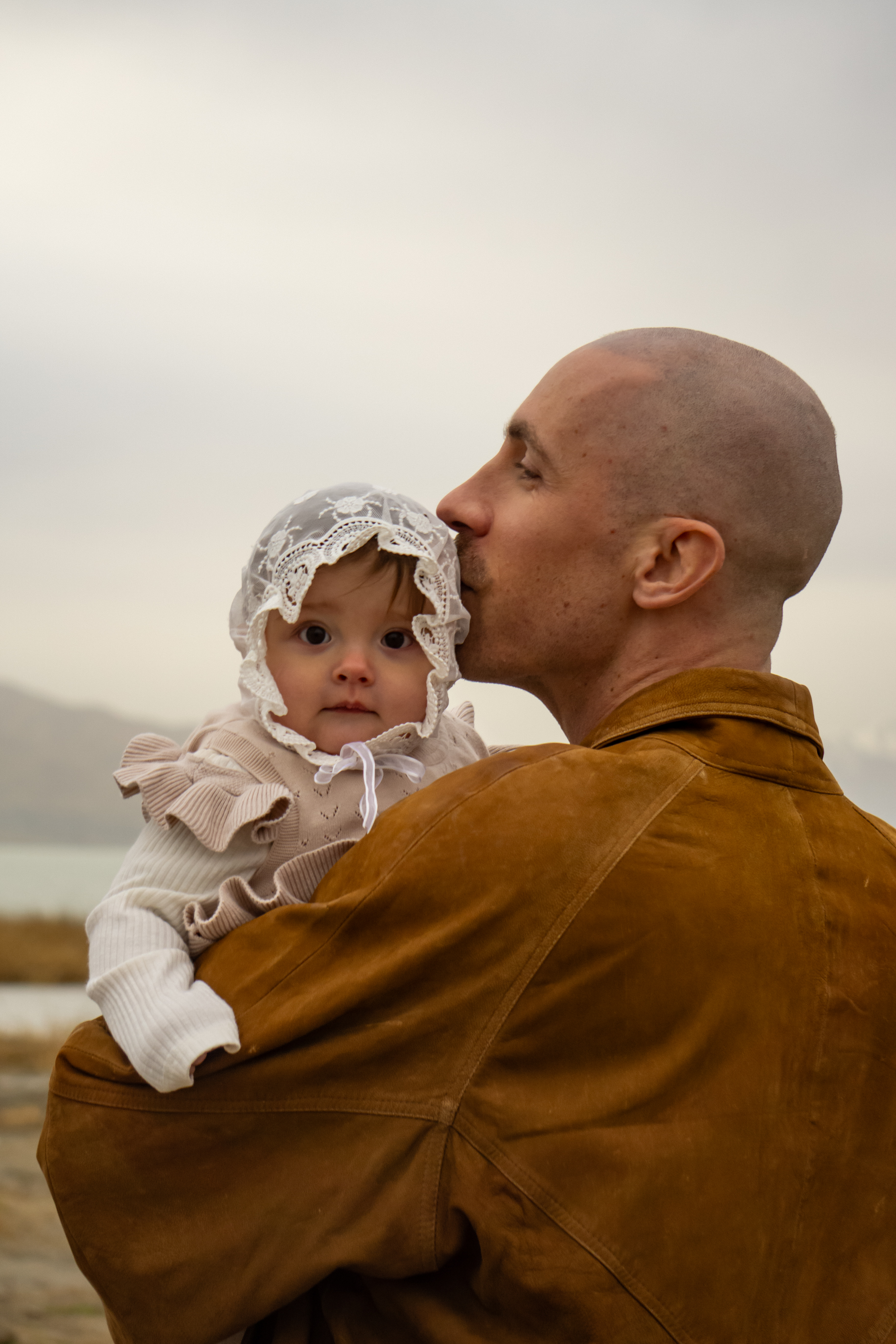 Family — Father tenderly kissing his baby
