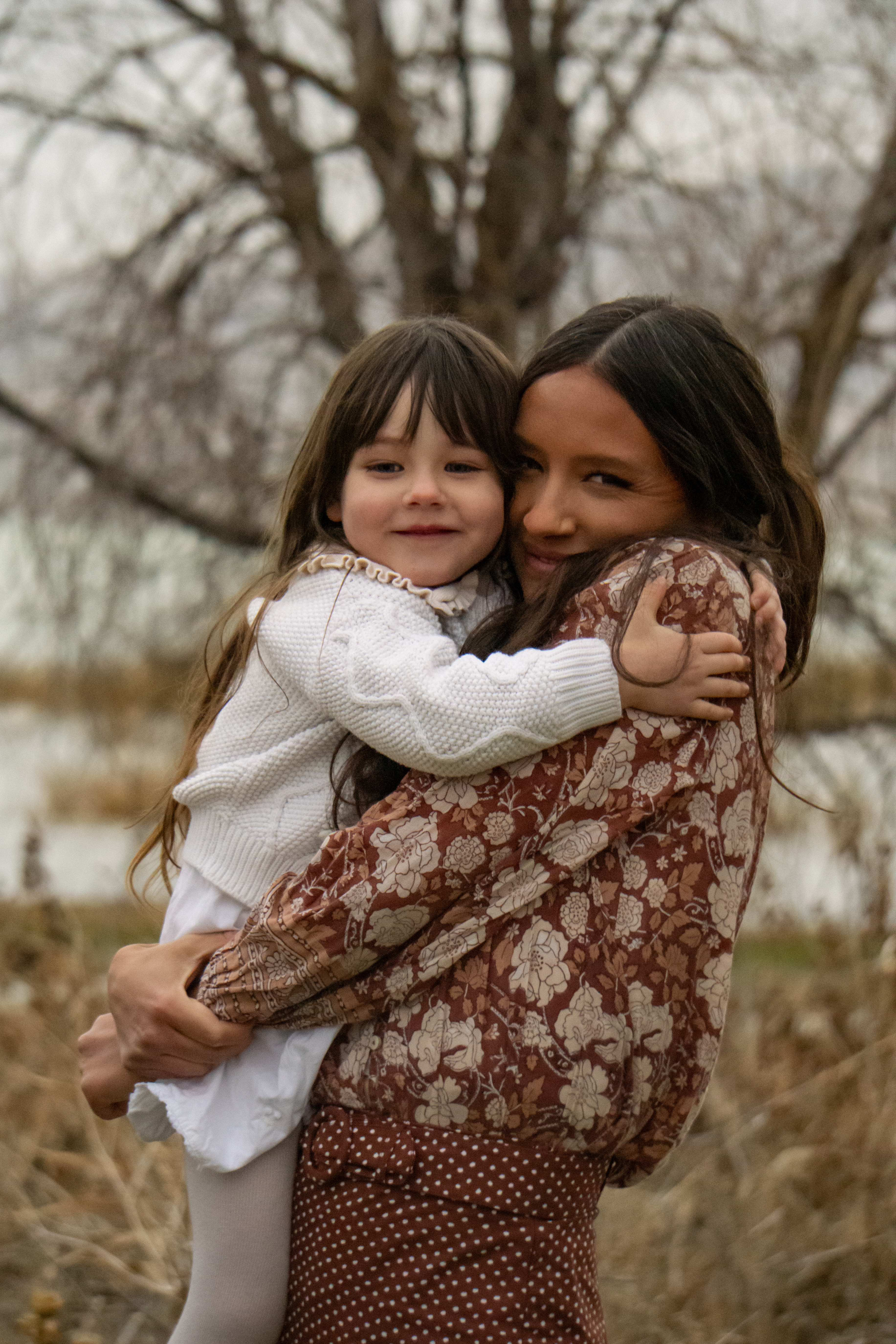 Family — Mother and daughter sharing a warm embrace