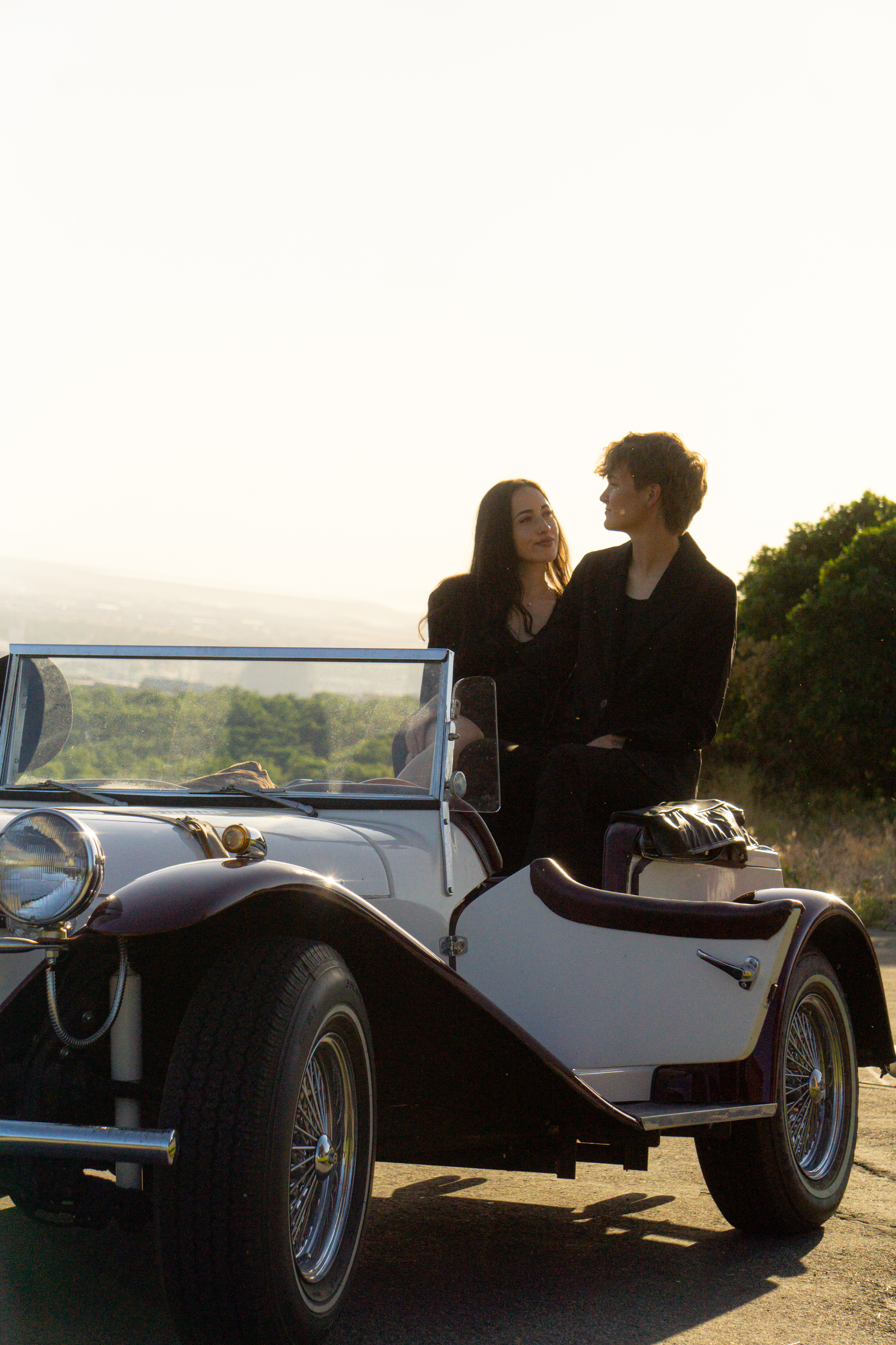 Couples — Kiss reflected in a vintage car windshield