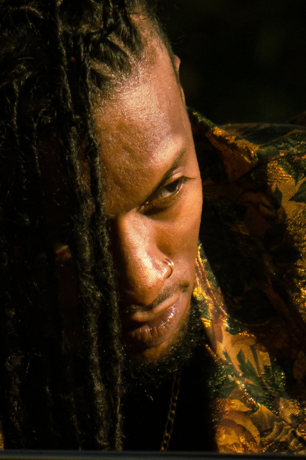 Portrait — Man with dreadlocks in dramatic close-up